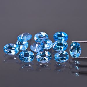 Oválný kámen, kužel - topaz Swiss Blue 7x5 MM